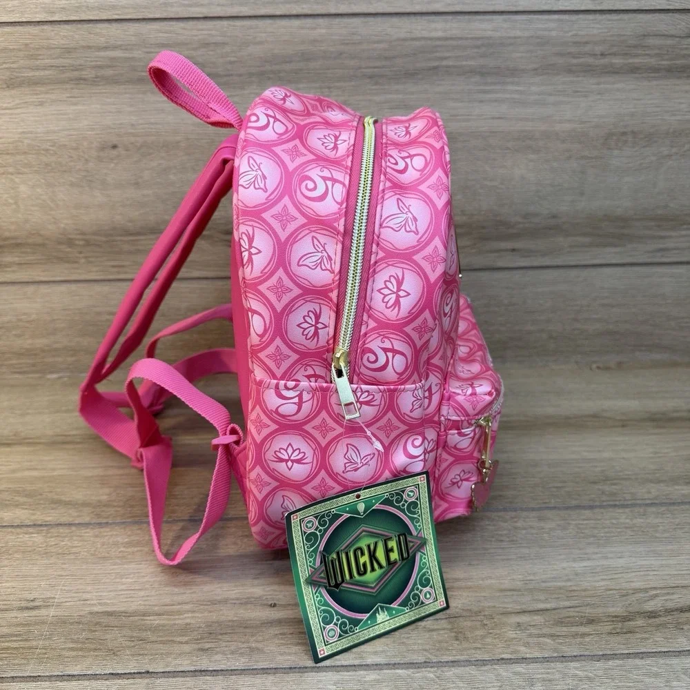 Universal Wicked Glinda Pink Monogram Mini Backpack Crown Pouch Butterfly Charm